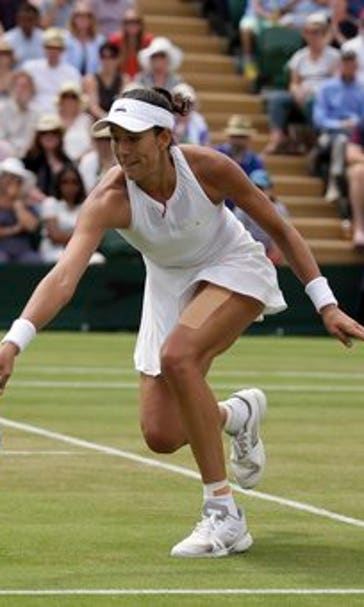 The Latest: Play on some courts at Wimbledon delayed by rain
